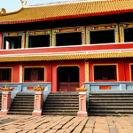 ** A vibrant photograph showcasing the successful restoration of a historic Vietnamese temple. Focus on intricate architectural details, with skilled artisans meticulously applying traditional techniques. Capture the sense of cultural pride and the preservation of national heritage.

**